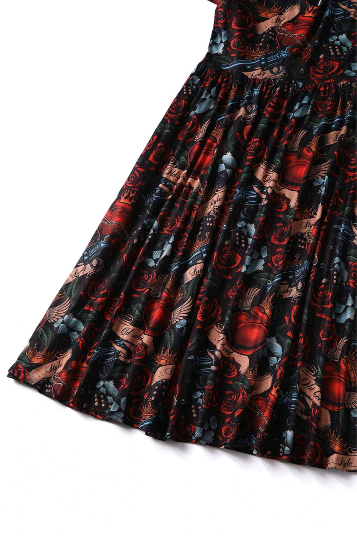 Dolly and Dotty Billie Long Sleeved Guns and Roses Print Retro Dress, Close up View of Skirt
