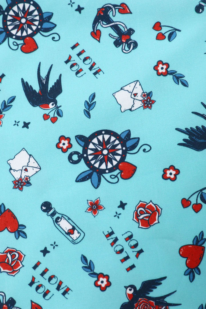Nautical-themed fabric pattern with anchors, stars, and 'I love you' text, close up