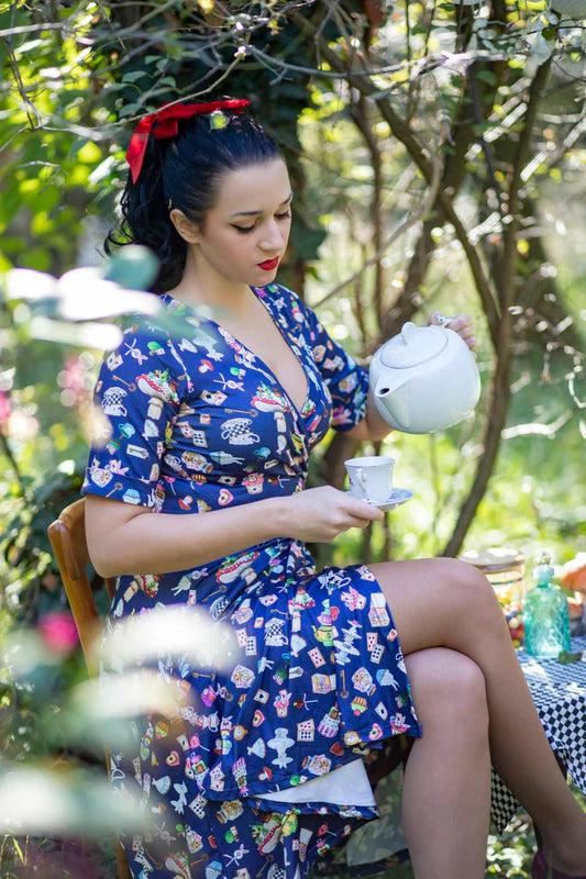 Model wearing Dolly and Dotty Matilda Navy Blue Wonderland Vintage Style Dress, Front