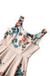 Floral swing dress with a floral pattern on a white background, top of dress.