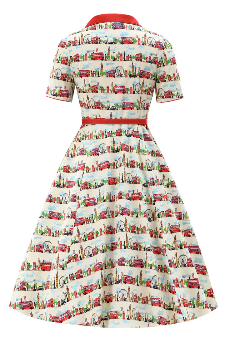 Back of vintage-style dress with retro London pattern on a white background