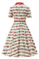 Back of vintage-style dress with retro London pattern on a white background