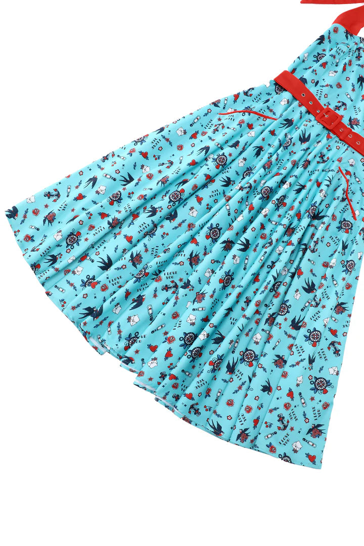 Blue dress with red accents and a floral pattern on a white background, skirt view